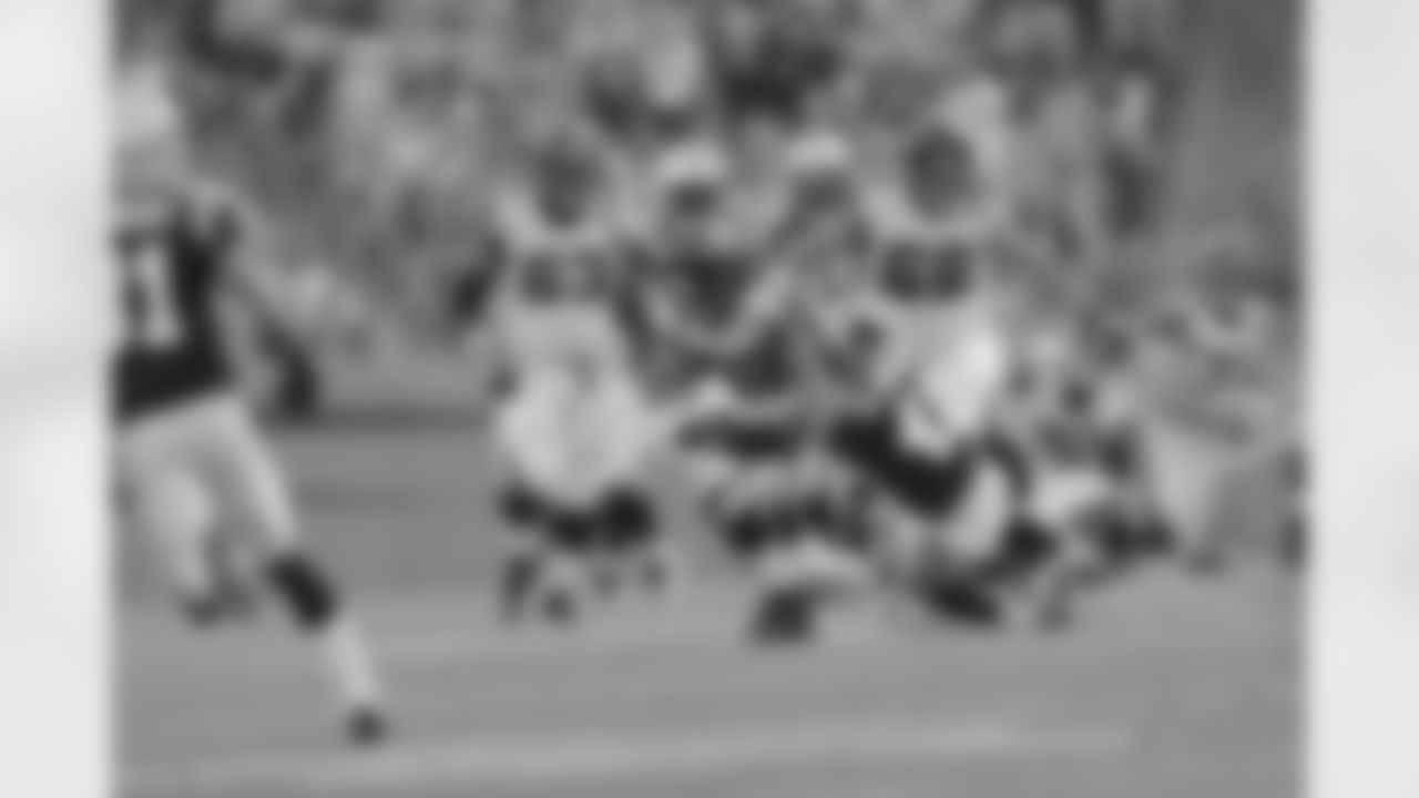 RB Jacquizz Rodgers is brought down by a Carolina defender