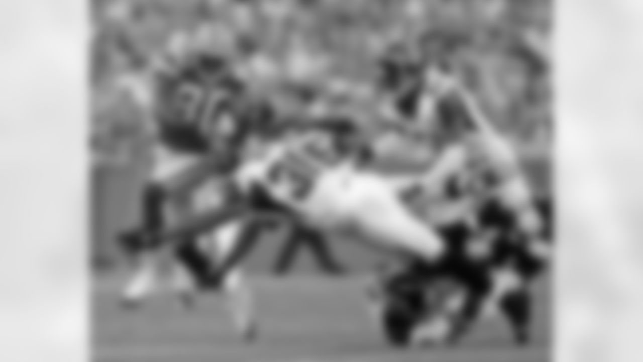 Atlanta Falcons' Lawyer Millow, Ryan Bowers, Demorrio Williams and Cam Newton try to stop Packers WR Donald Driver on August 19, 2006