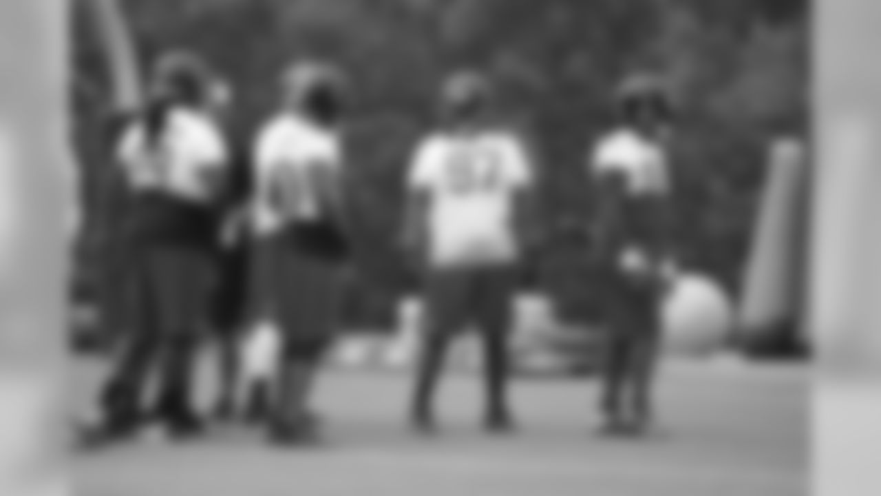 DT Peria Jerry talks to his teammates at minicamp