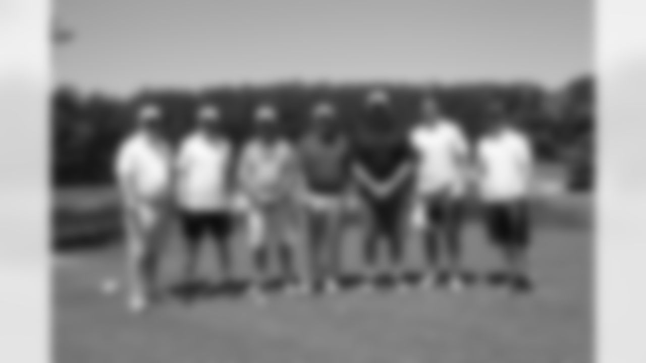 OG Joe Hawley's group poses with head coach Mike Smith on the golf course