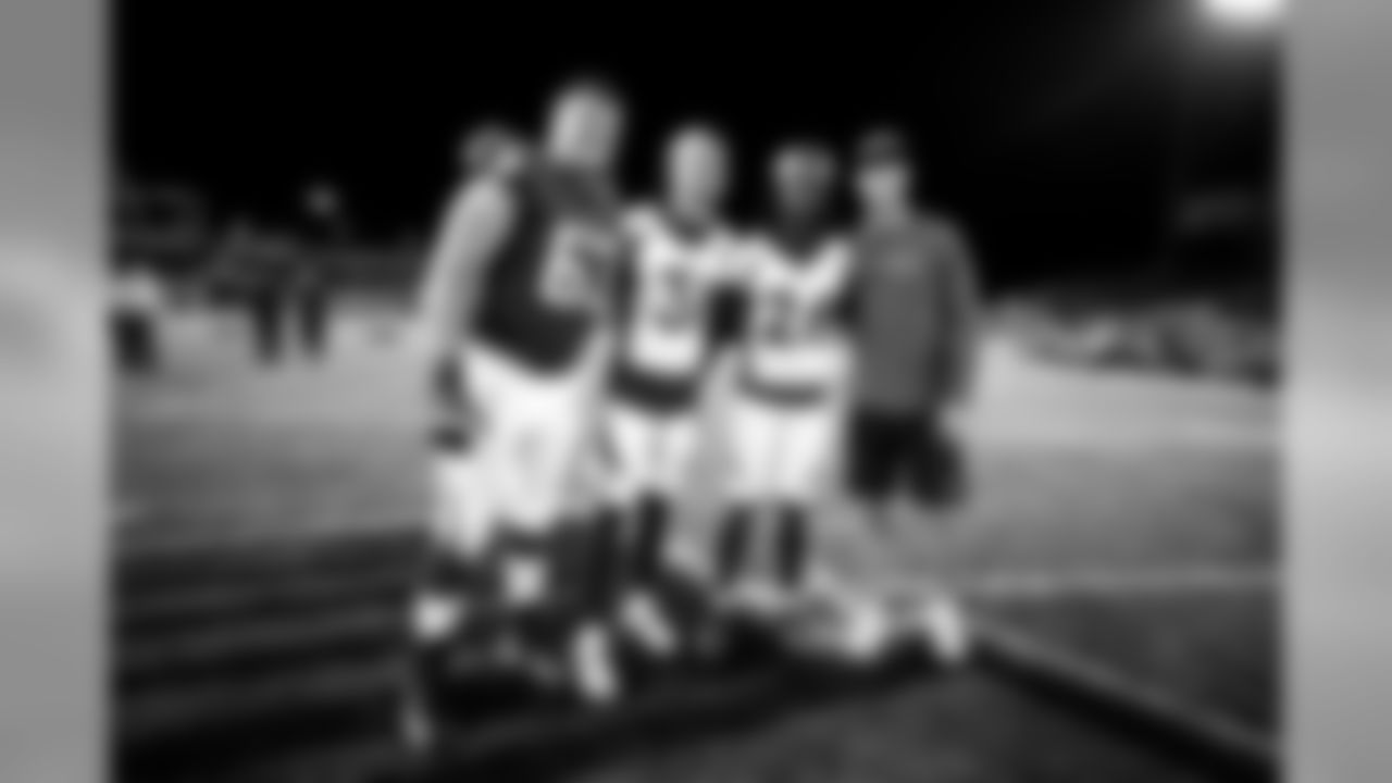 Atlanta Falcons offensive guard Chris Lindstrom #63 and quarterback Matt Ryan #2 pose with Denver Broncos free safety Justin Simmons #31 and cornerback Isaac Yiadom #26 after the game at Tom Benson Hall of Fame Stadium in Canton, Ohio, on Thursday August 1, 2019. (Photo by Kara Durrette/Atlanta Falcons)