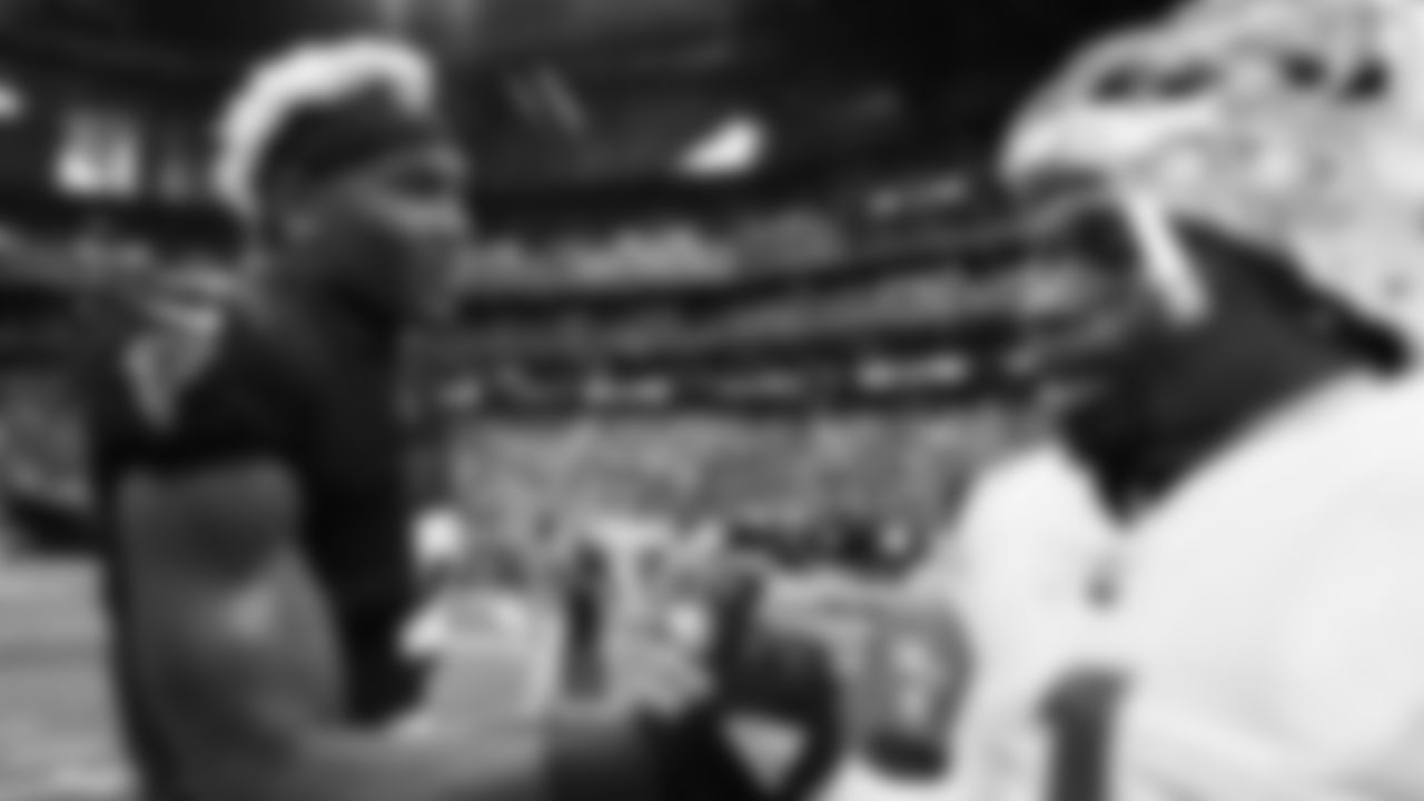 Atlanta Falcons inside linebacker Mykal Walker #3 talks with Los Angeles Chargers wide receiver DeAndre Carter #1 after their game at Mercedes-Benz Stadium in Atlanta, Georgia on Sunday, November 6, 2022. (Photo by Mitchell Martin/Atlanta Falcons)
