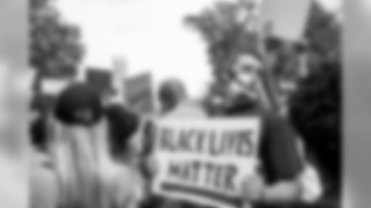 Josh Blank, son of Arthur Blank, holds a Black Lives Matter sign during the Buckhead for Black Lives protest event to the Governor's mansion in Atlanta, Georgia, on Sunday June 7, 2020. (Photo by Kara Durrette/Atlanta Falcons)