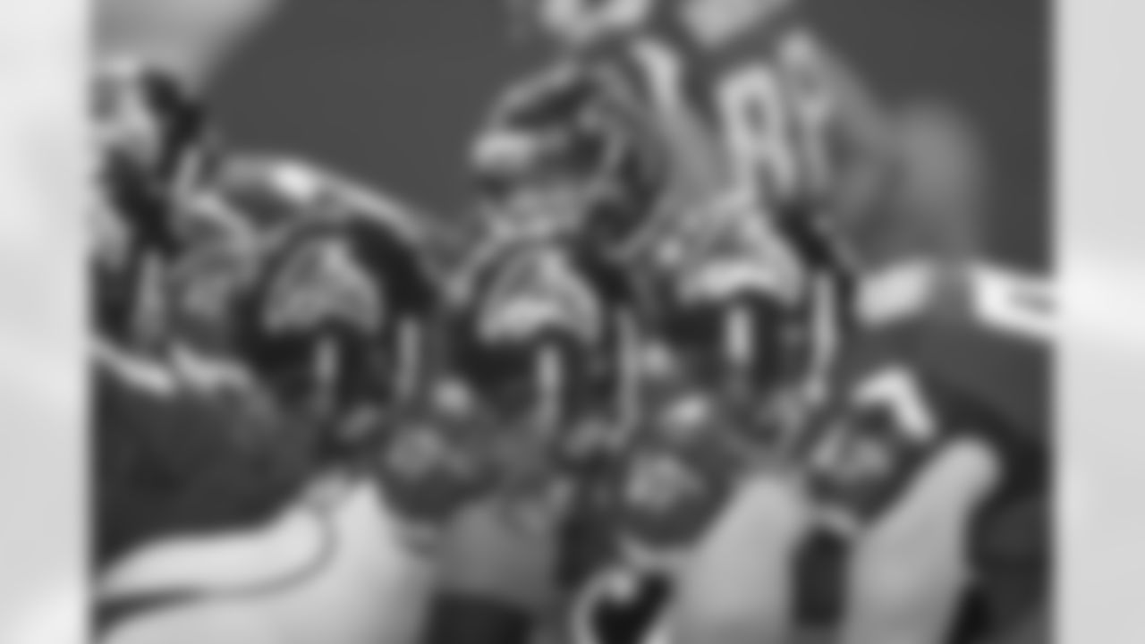 QB Matt Ryan peeks out from behind his offensive line.