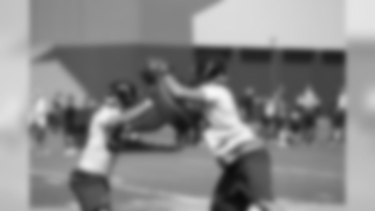 LB Paul Worrilow pushes against LB Brenden Daley