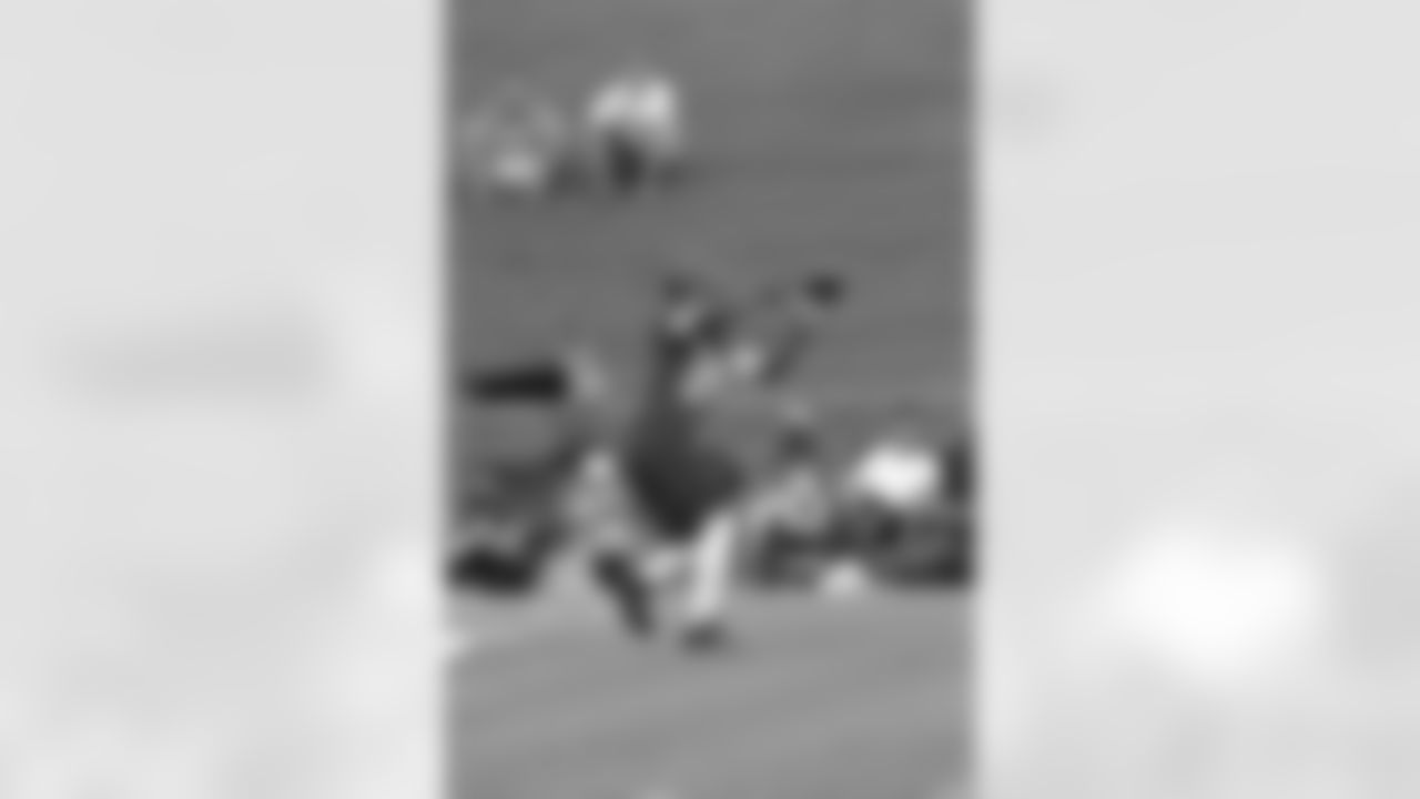 WR Roddy White catches a pass as fans watch