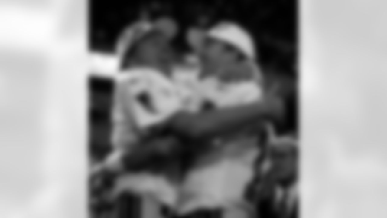 FILE - In this Jan. 17, 1999, file photo, Atlanta Falcons' Morten Andersen, left, and Chris Chandler celebrate on the podium after the Falcons beat the Minnesota Vikings 30-27 to win the NFC Championship, in Minneapolis. The Falcons are in rare territory, indeed. For only the eighth time in franchise's 51-season history, they are among the final eight teams in the NFL playoffs. Of course, the Falcons have never won a Super Bowl title, a burden that hangs over this year's high-scoring team heading into Saturday's divisional round game against the Seattle Seahawks. (AP Photo/John Bazemore, File)