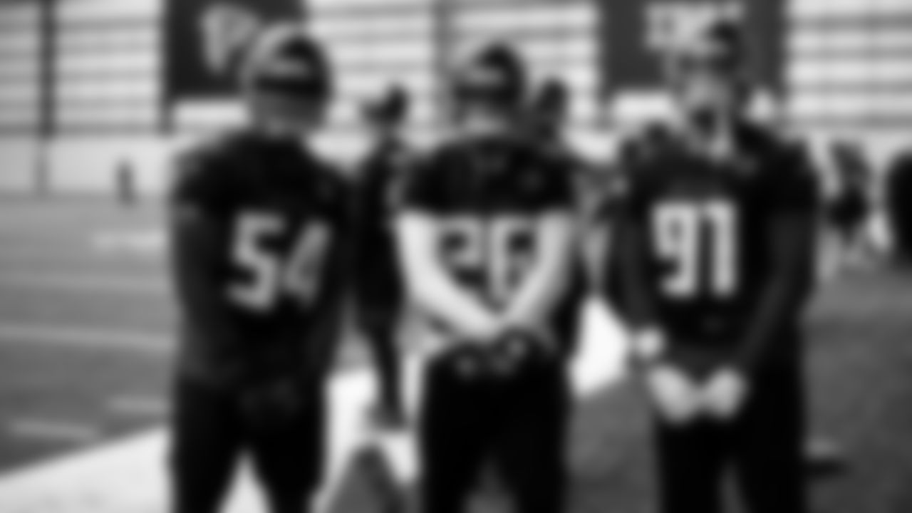 Atlanta Falcons linebacker Foye Oluokun #54, cornerback Isaiah Oliver #26 and defensive tackle Jacob Tuioti-Mariner #91 stand together during practice at IBM Performance Field.
