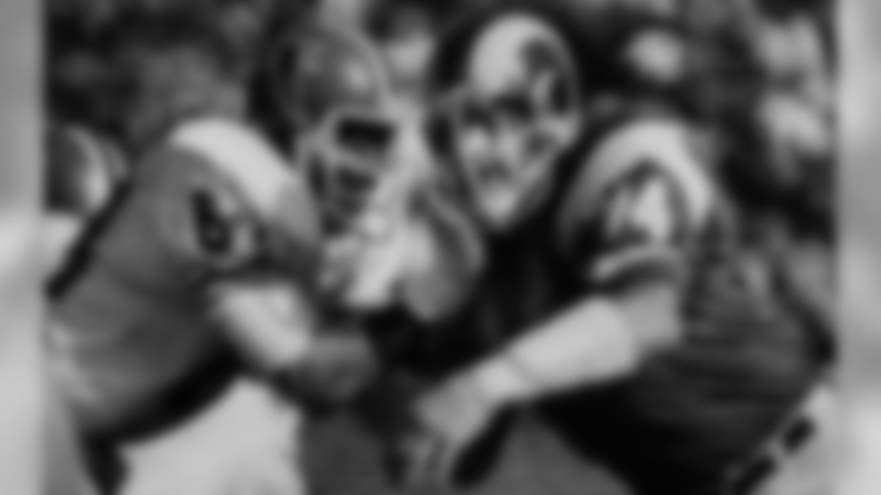 Los Angeles Rams' Merlin Olsen battles Atlanta guard Gregg Kindle on December 4, 1976