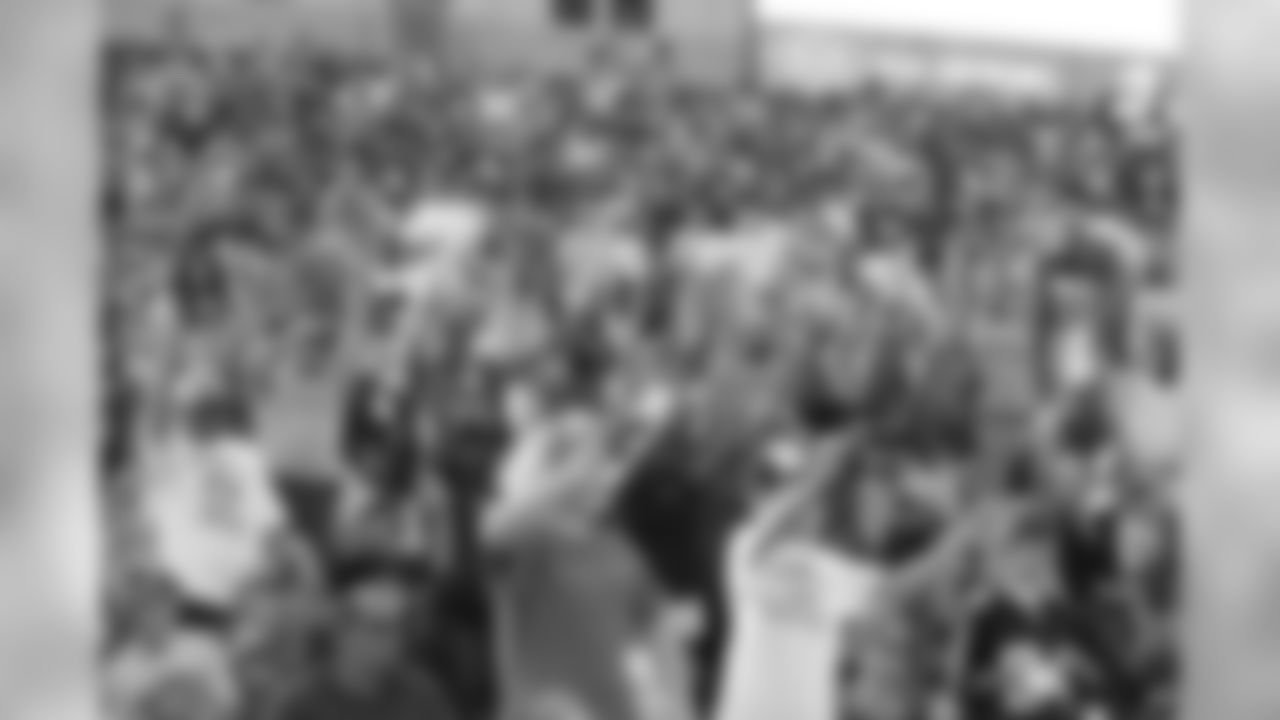 Fans reacting to the t-shirt cannons // 2011 Friday Night Lights // August 5, 2011 // Norcross, Ga. —