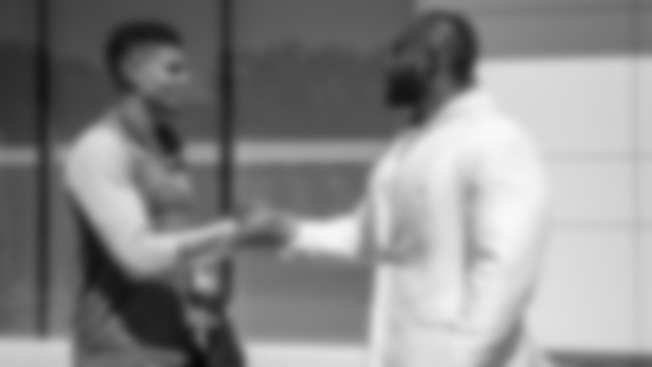 Atlanta Falcons defensive lineman Grady Jarrett #97 greets Miles Robinson as he visits Atlanta United Training Ground in Marietta, Georgia, on Tuesday, April 11, 2023. (Photo by Shanna Lockwood/Atlanta Falcons)