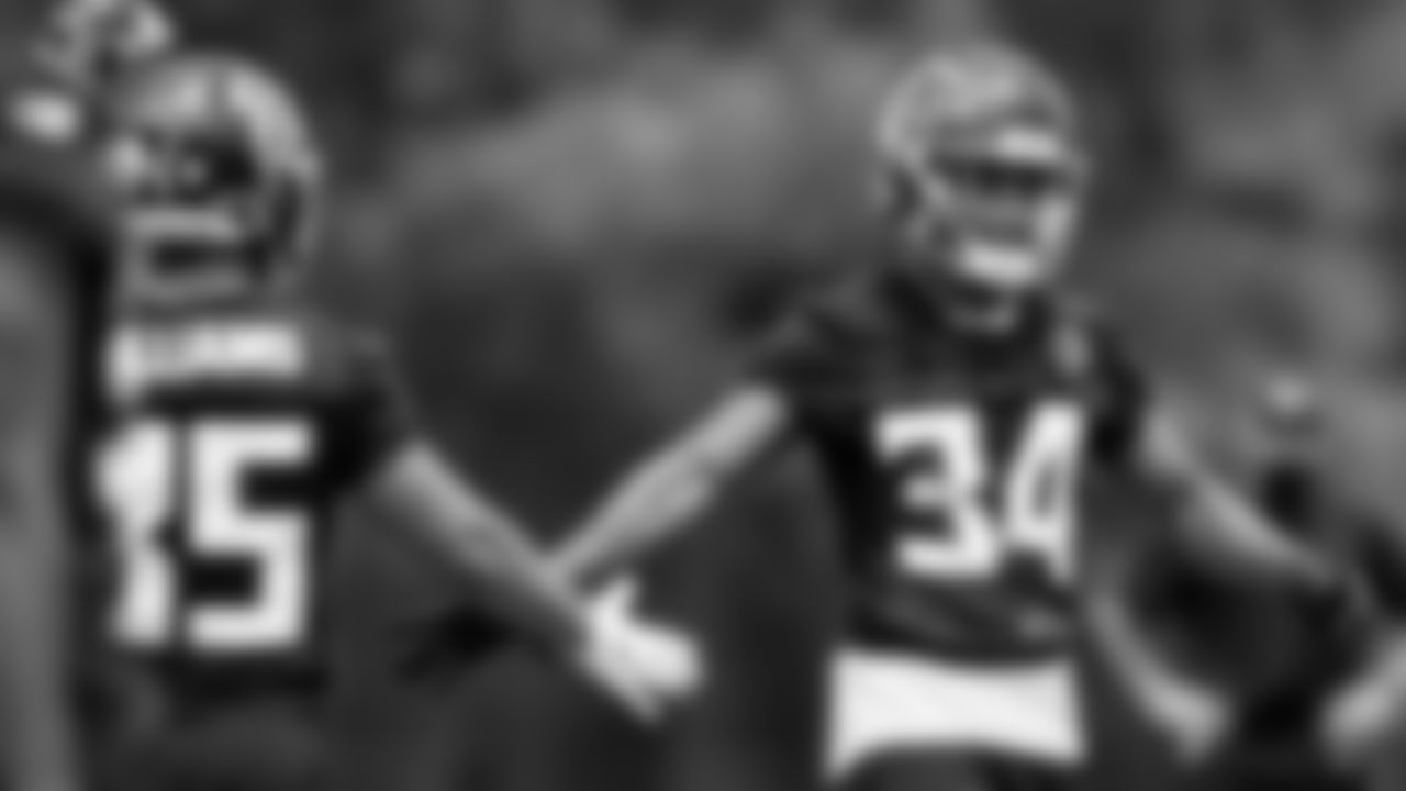 Atlanta Falcons cornerback Darren Hall #34 celebrates with cornerback Avery Williams #35 during the first practice of Atlanta Falcons rookie minicamp on May 14, 2021.