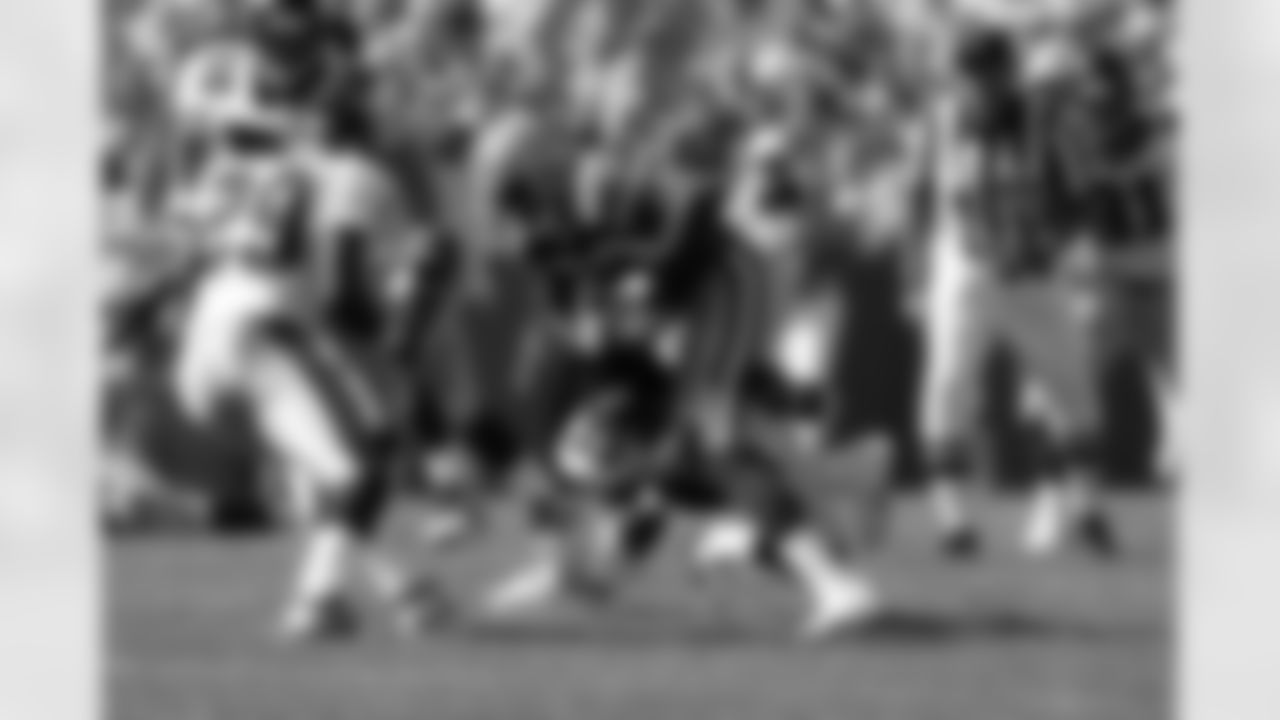 Packers WR Donald Driver runs as the Falcons defense is approaching on September 8, 2002.