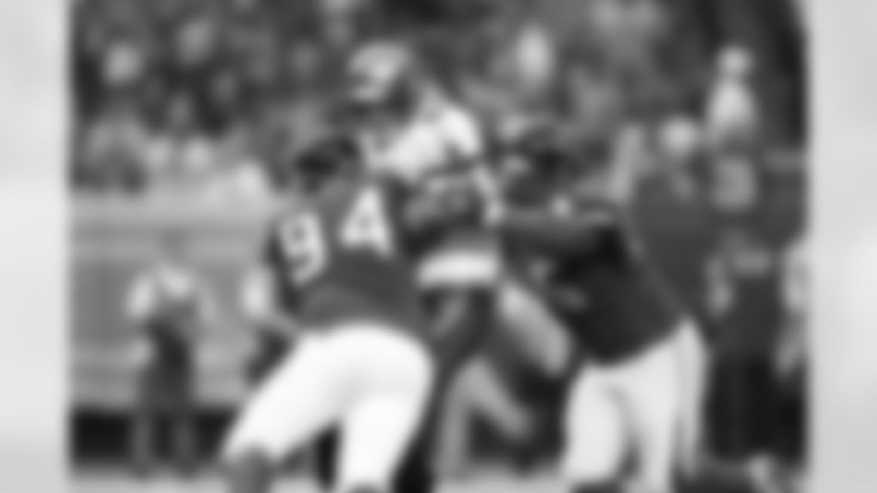 DT Peria Jerry and DT Jonathan Babineaux close in on Buccaneers QB Mike Glennon
