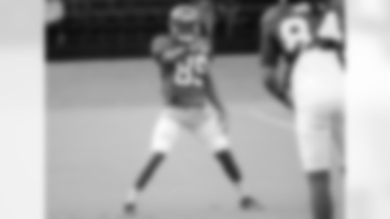WR Bernard Reedy laughs while continuing to call WR Roddy White out during warm-ups