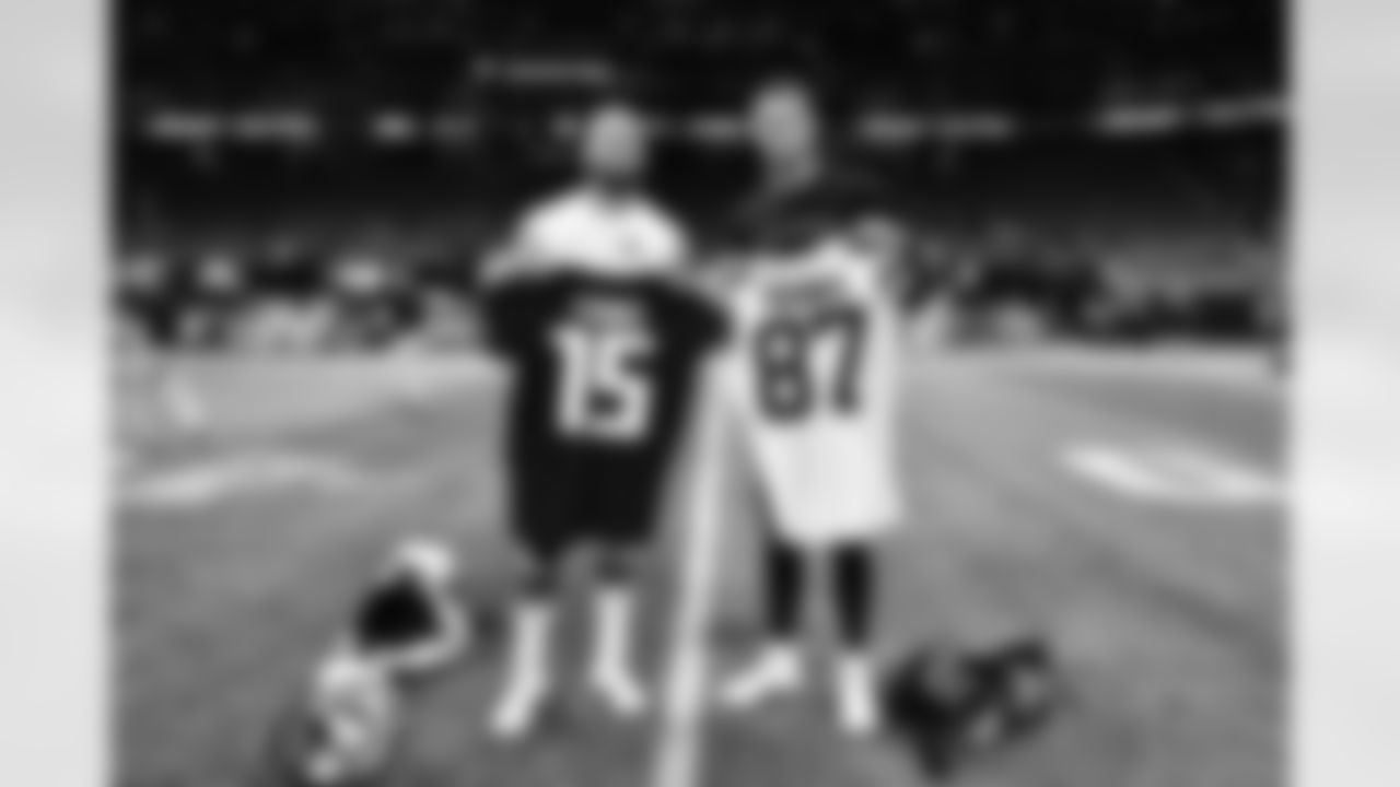 Atlanta Falcons quarterback Feleipe Franks #15 poses for a photo with his brother Jordan Franks #87 of the Cleveland Browns after the game at Mercedes-Benz Stadium in Atlanta, Georgia on Sunday, August 29, 2021. (Photo by Kyle Hess/Atlanta Falcons)