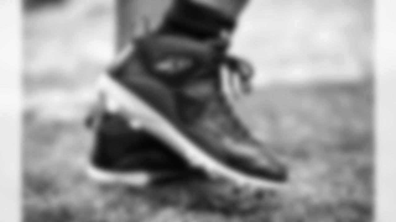 A detail view of the cleats of Atlanta Falcons fullback Keith Smith #40 prior to a game against the New England Patriots at Mercedes-Benz Stadium in Atlanta, Georgia on Thursday, November 18, 2021. (Photo by Kyle Hess/Atlanta Falcons)