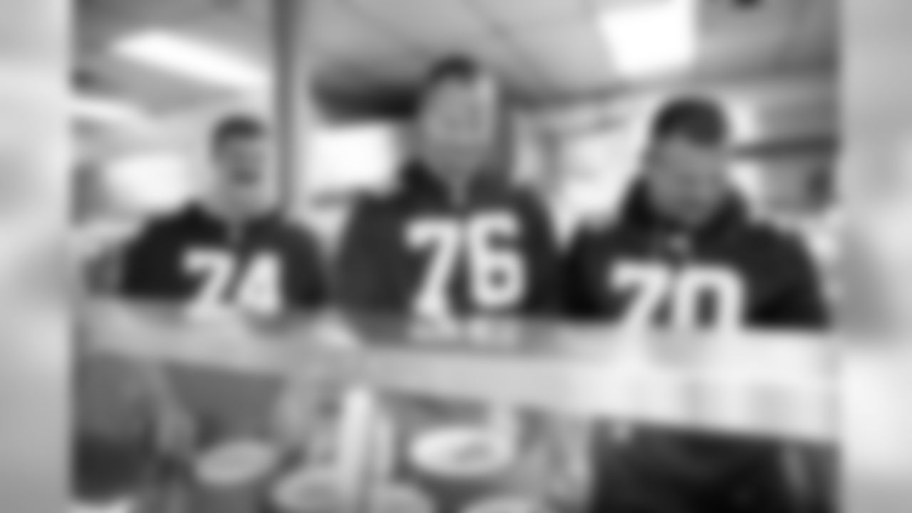 New York Giants Offensive Line helps at the Food Bank for NYC in Harlem, New York