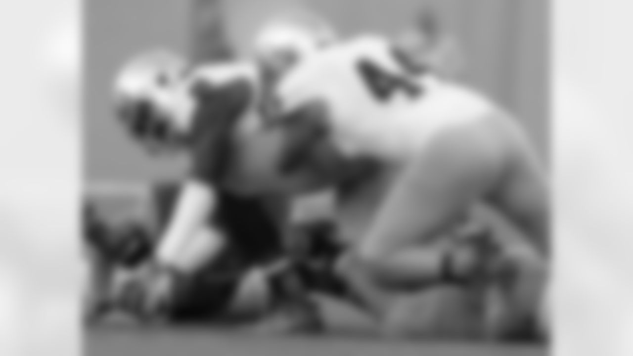 Notre Dame linebacker Jaylon Smith, front left, picks up a ball fumbled by Air Force quarterback Nate Romine, back left, as Notre Dame linebacker Carlo Calabrese, front right, covers in the third quarter of Notre Dame's 45-20 victory in an NCAA football game in Air Force Academy, Colo., Saturday, Oct. 26, 2013. (AP Photo/David Zalubowski)