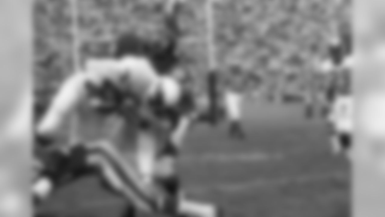 Bulldozer Tom Woodeschick (37) Philadelphia Eagles running back, makes a short gain in the first period of an Eagles Giants game, Aug. 30, 1969. The Eagles won, 24-17. Giant back Henry Davis (66) makes the tackle. Woodeschick did much of the Eagles ball carrying. (AP Photo/Ray Howard)