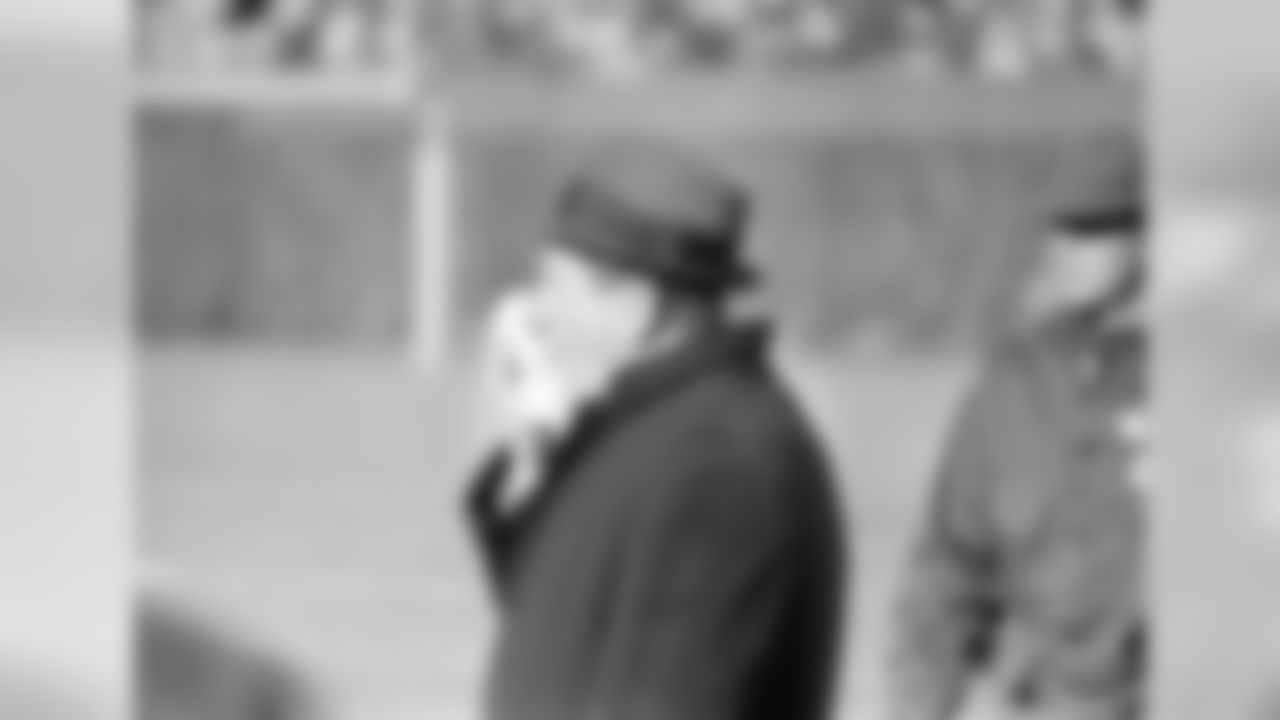 Allie Sherman, coach of the New York Giants, holds a handkerchief to his face for warmth as he stands on the cold sidelines at Wrigley Field in Chicago, Ill., during the NFL championship game with the Chicago Bears, Dec. 29, 1963. (AP Photo)