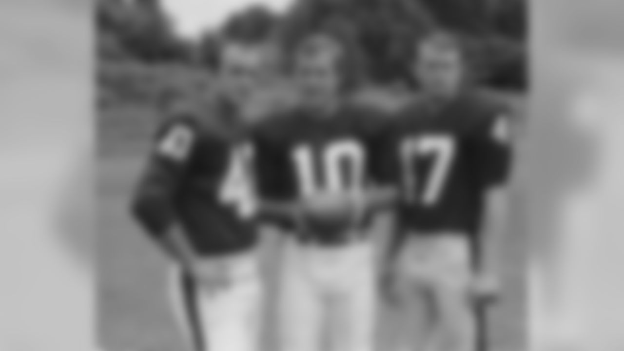 Fran Tarkenton, quarterback, New York Giants, (10) flanked by left Joe Morrison, and Joe Koontz (47) right, in 1968. (AP Photo)