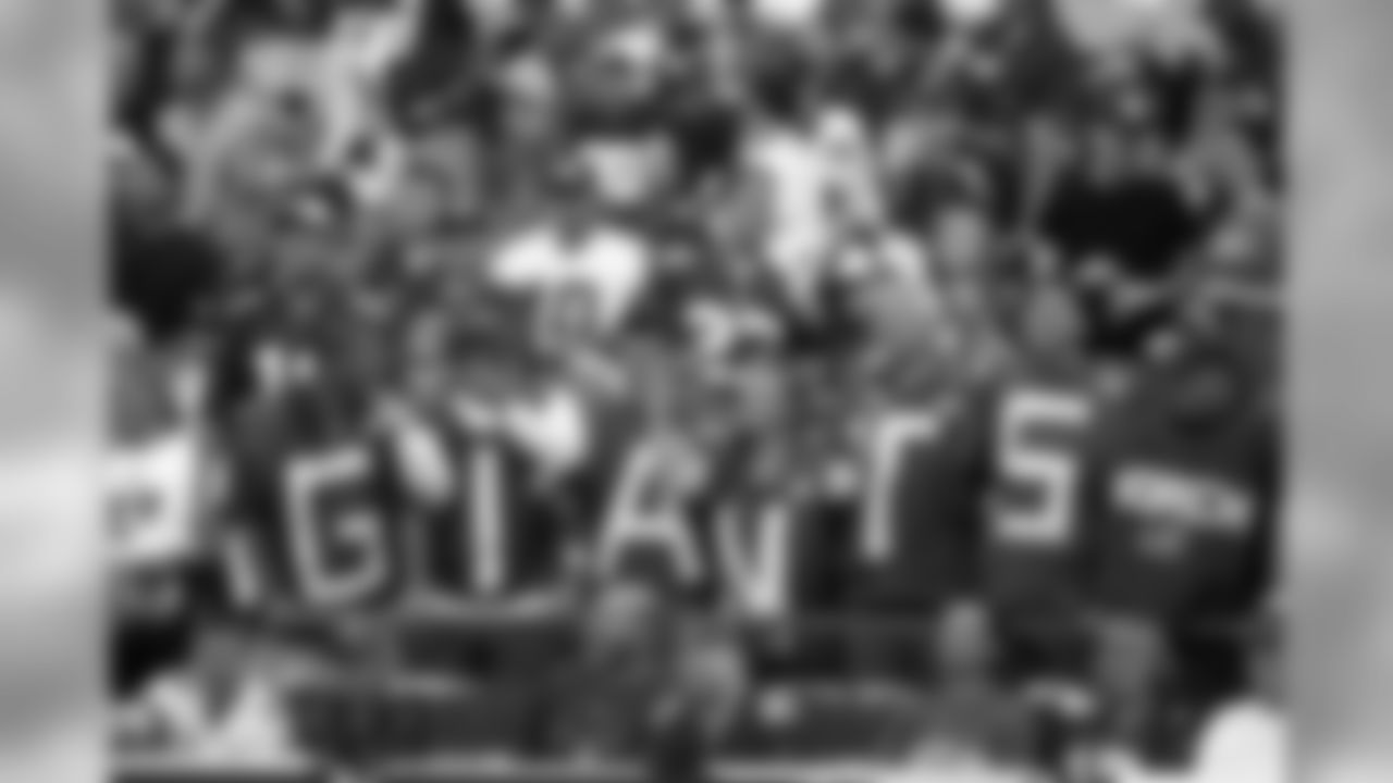Fans look on in the second half of an NFL football game between the New York Giants against the Washington Redskins, Sunday, Sept. 13, 2009 in East Rutherford, N.J. (AP Photo/Tim Larsen)