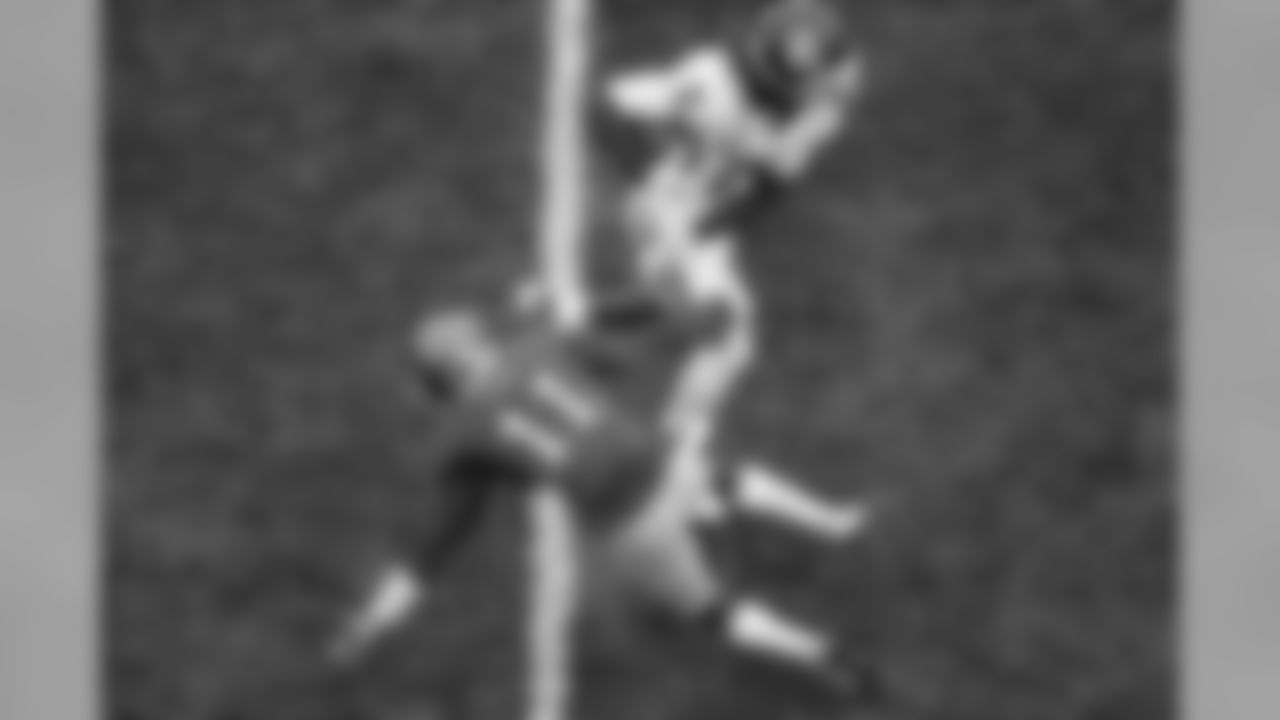 Oklahoma wide receiver CeeDee Lamb (2) gets past Kansas safety Mike Lee (11) to score a touchdown during the first half of an NCAA college football game Saturday, Oct. 5, 2019, in Lawrence, Kan. (AP Photo/Charlie Riedel)