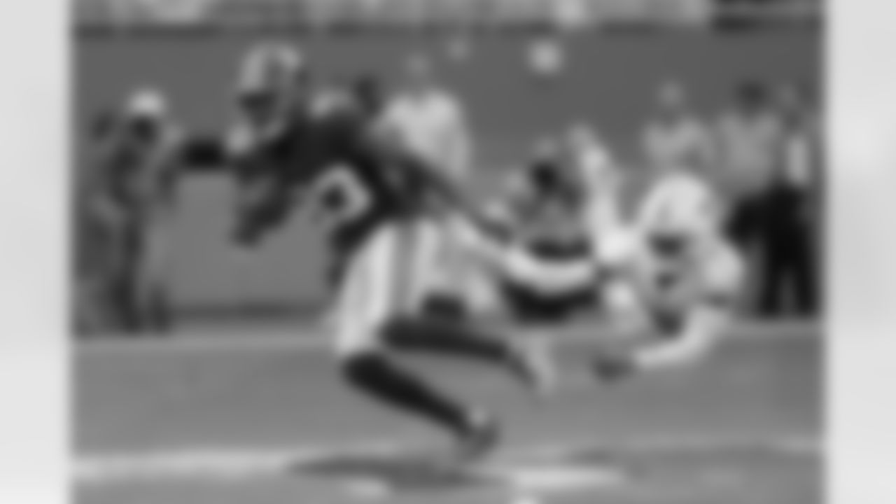 New York Giants wide receiver Pharoh Cooper (83) evades a tackle by Miami Dolphins cornerback Noah Igbinoghene (9) during the first half of an NFL football game, Sunday, Dec. 5, 2021, in Miami Gardens, Fla. (AP Photo/Lynne Sladky)