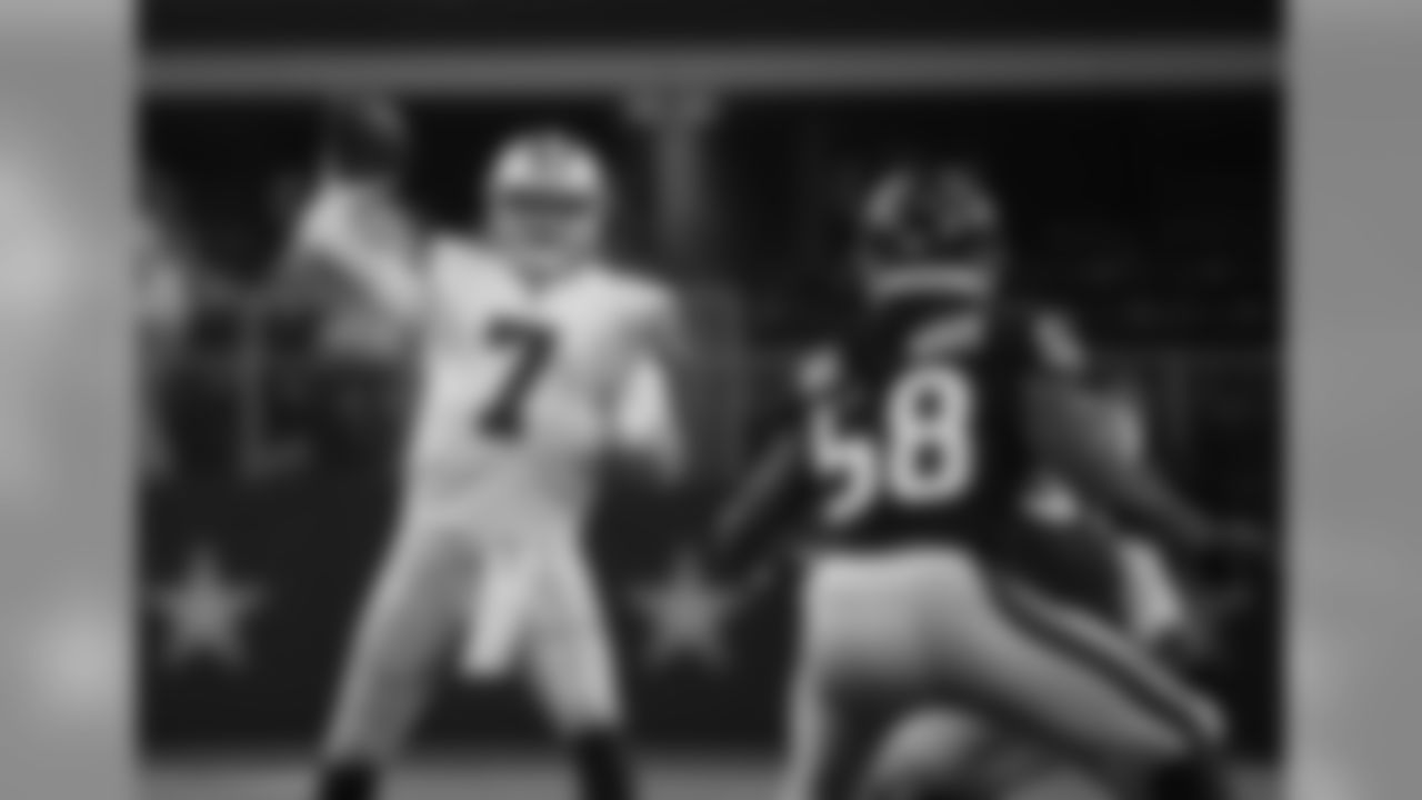 Dallas Cowboys quarterback Cooper Rush (7) throws a pass as Houston Texans linebacker Peter Kalambayi (58) defends in the first half of a preseason NFL football game in Arlington, Texas, Saturday, Aug. 24, 2019. (AP Photo/Michael Ainsworth)