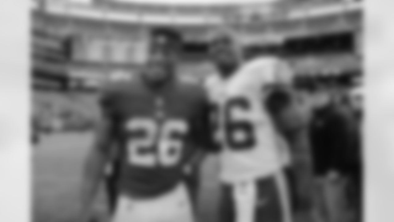Washington Redskins Adrian Peterson, right, poses for a picture with New York Giants Saquon Barkley after an NFL football game, Sunday, Oct. 28, 2018, in East Rutherford, N.J. (AP Photo/Seth Wenig)