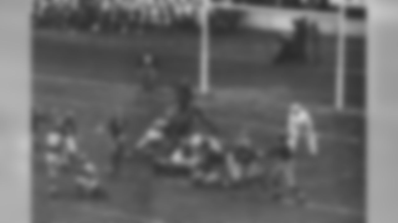 Ken Strong (30), kicking the 2nd of 3 field goals which scored for the New York Giants in their game against the Washington Redskins at the Polo Grounds in New York City, Dec. 3, 1939. The Giants Won 9-7. The ball is in the air just above Frank Filchock (30) of Redskins. The victory gave the Giants the Eastern Division Championship of the National Football League for the 2nd consecutive year. Redskins shown are Jim Barber (15) and Steve Slivinski (16). Giants are Tuffy Leemans (4), John "Bull" Karcis (11); Ed Widseth (50) and Nello "Flash" Falaschi (28). (AP Photo)