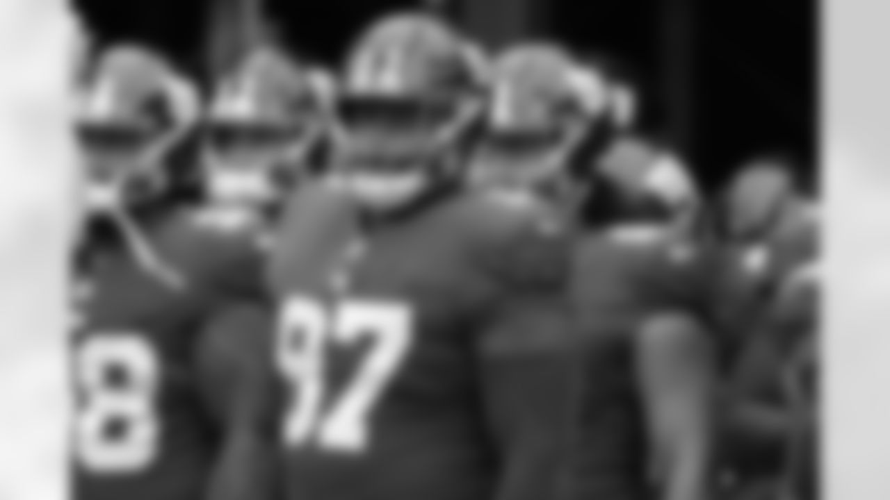 New York Giants defensive tackle Dexter Lawrence (97) stands with teammates before an NFL preseason football game against the New England Patriots Sunday, Aug. 29, 2021, in East Rutherford, N.J. (AP Photo/Noah K. Murray)
