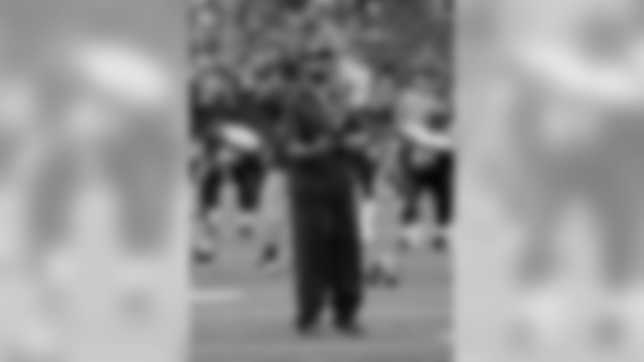 Seattle Seahawks defensive coordinator Kris Richard watches pregame warmups before an NFL preseason game against the Kansas City Chiefs, August 25, 2017 in Seattle. The Seahawks defeated the Chiefs 26-13. (Kevin Terrell via AP)