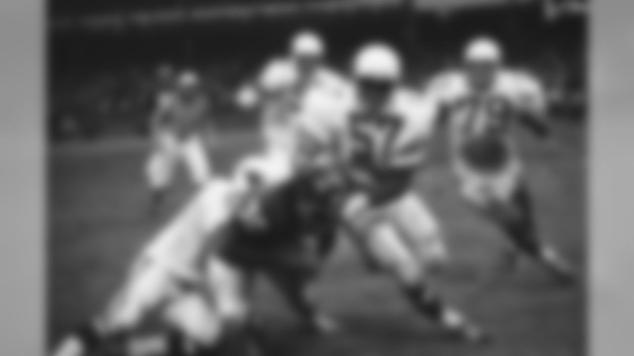 Ron Johnson (30) of the New York Giants is tackled from behind by Larry Wilson (8) of the St. Louis Cardinals after making 17-yard gain in fourth quarter in New York on Sunday, Oct. 26, 1970. Making head tackle is Don Parish (57) of the Cardinals, followed by teammates Joe Schmiesing (82) and Chuck Walker (79). (AP Photo)
