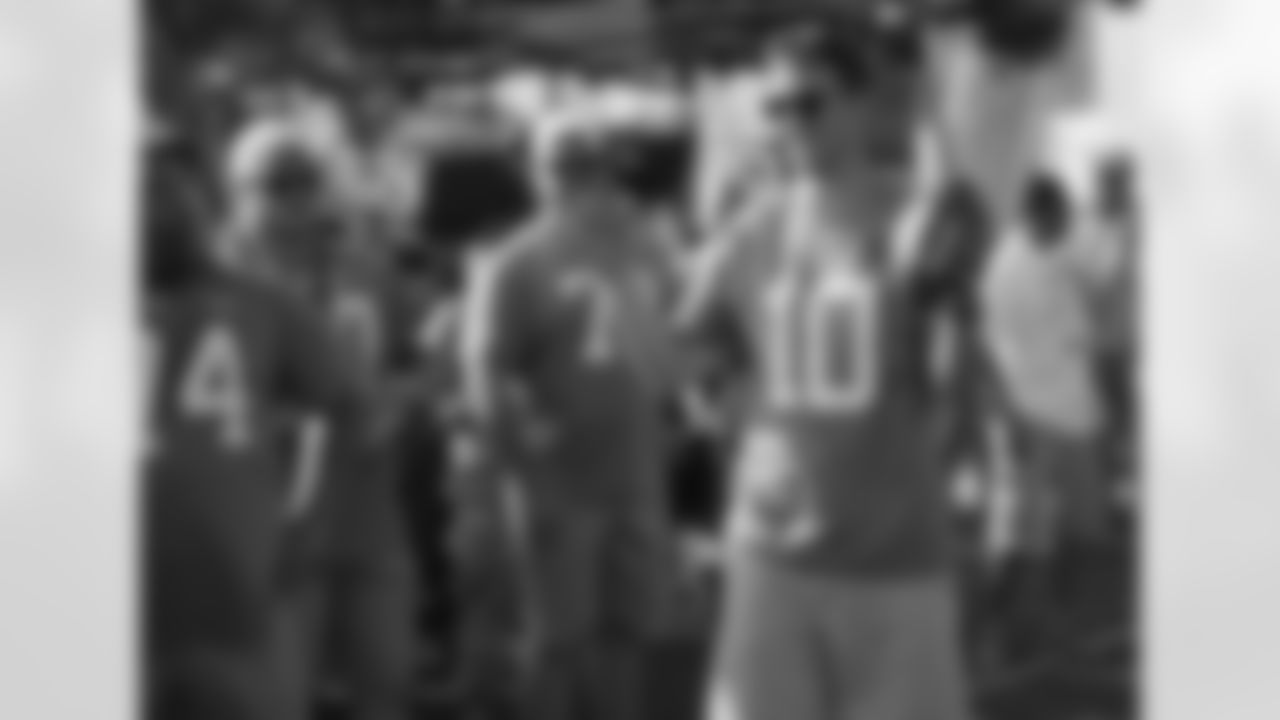 New York Giants quarterback Eli Manning (10), New York Jets center Nick Mangold (74), Buffalo Bills center Eric Wood (70), Tampa Bay Buccaneers guard Logan Mankins (70) are seen at the NFL Pro Bowl football draft at Wheeler Army Airfield, Wednesday, Jan. 27, 2016, in Wahiawa, Hawaii. (AP Photo/Marco Garcia)