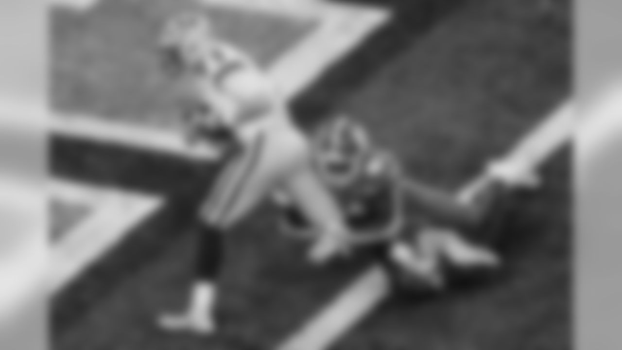 LSU quarterback Joe Burrow scores past Clemson safety Denzel Johnson during the first half of a NCAA College Football Playoff national championship game Monday, Jan. 13, 2020, in New Orleans. (AP Photo/Eric Gay)