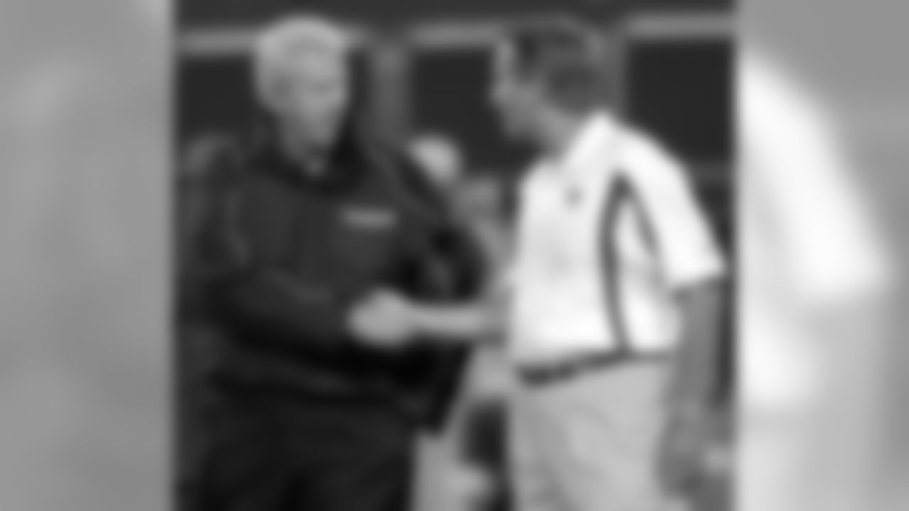Dallas Cowboys coach Bill Parcells, left, shakes hands with New York Giants coach Jim Fassel, prior to the game at Giants Stadium in East Rutherford, N.J., Monday Sept. 15, 2003. (AP Photo/Bill Kostroun)