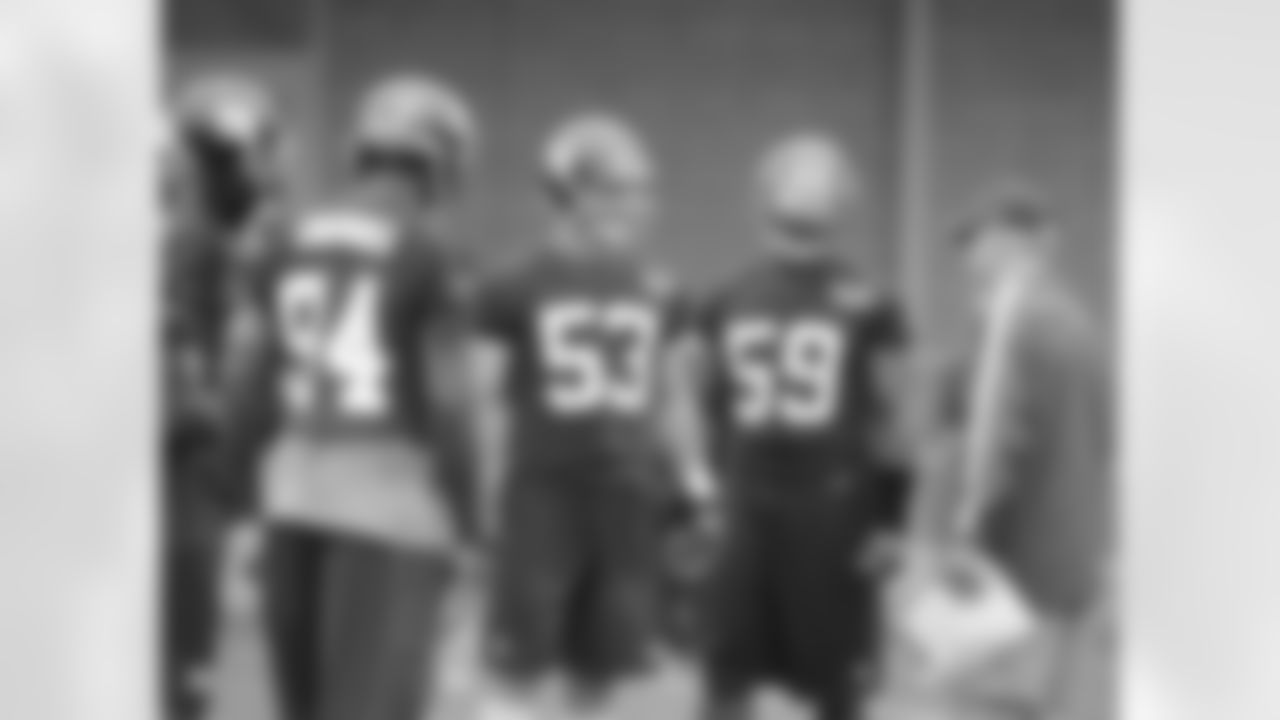 Coach Coughlin discusses the next play with the Giants second team defense