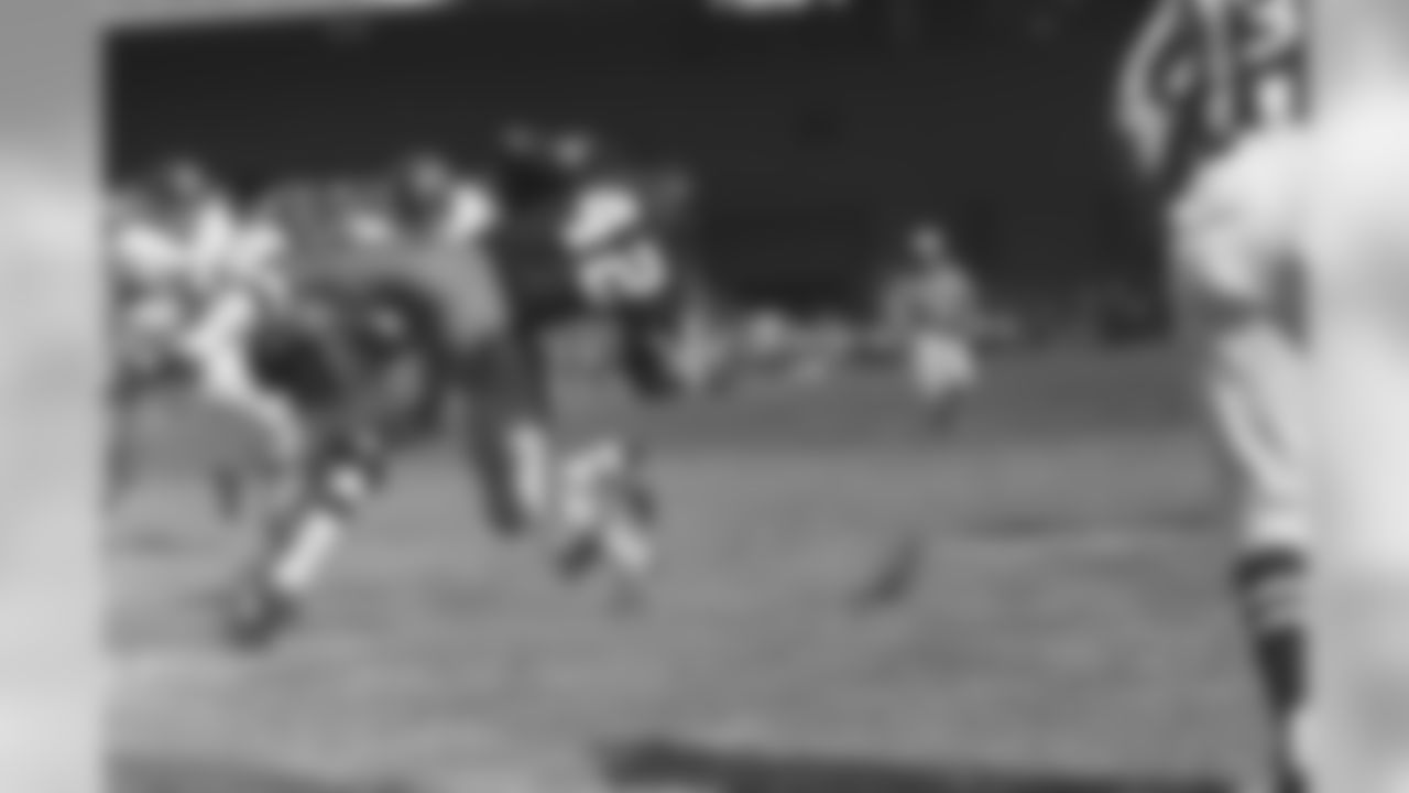 Charley Taylor of the Washington Redskins, takes to the air as he is hit by Clarence Childs of the New York Giants, in the second quarter of game on Oct. 2, 1967 in Washington. Taylor was stopped after catching a pass from quarterback Sonny Jurgensen and chalking up a five-yard gain. Other Giant players are: Ken Avery, 54, and Vince Costello, 57. Washington won 38-34. (AP Photo)