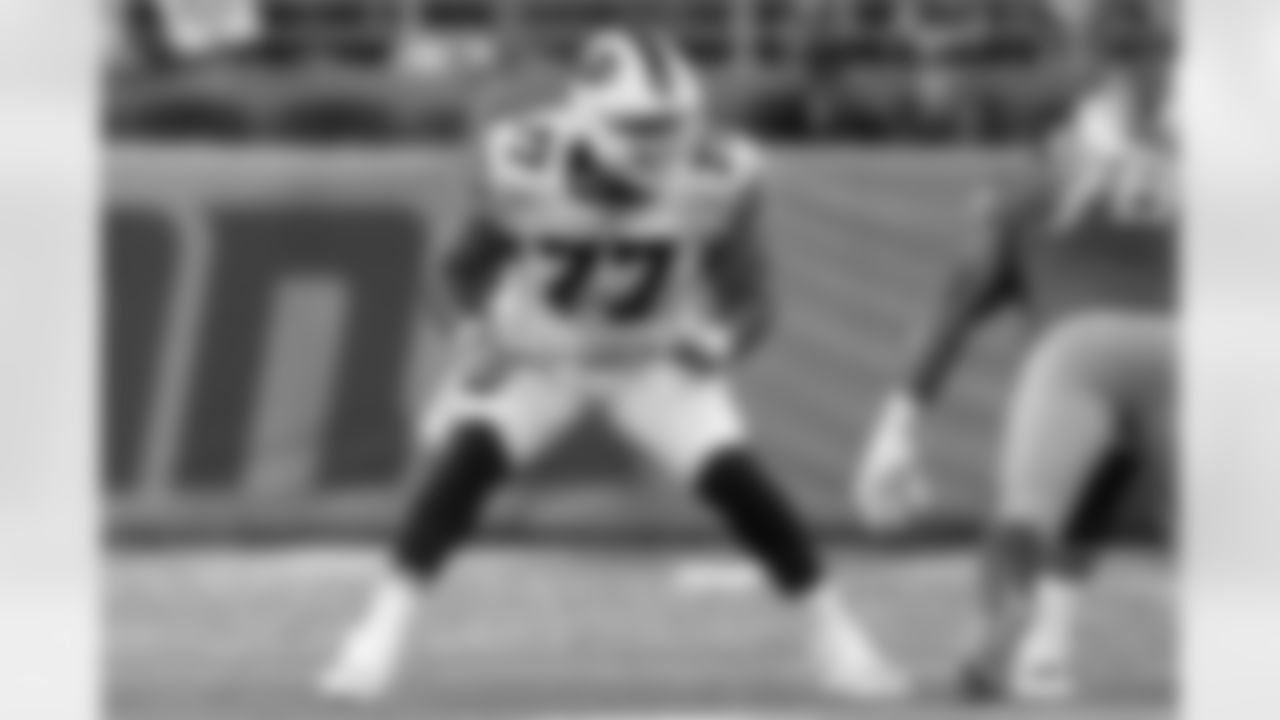 Buffalo Bills offensive guard Jamil Douglas (77) blocks during an NFL preseason football game against the Detroit Lions, Friday, Aug. 13, 2021, in Detroit. The Bills defeated the Lions, 16-15. (Ryan Kang via AP)