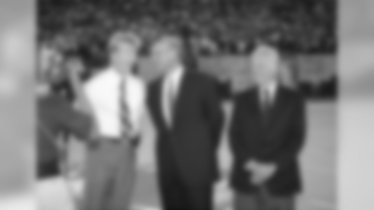 Phil Simms, GM-George Young and Co-Owner Robert Tisch of the New York Giants during Simms number Retirement held on September 4, 1995 at Giants Stadium in East Rutherford, NJ