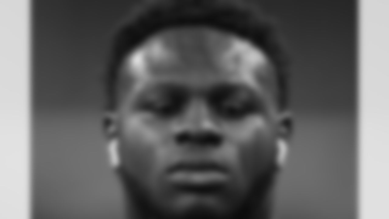 North Carolina State offensive lineman Ickey Ekwonu warms up for the 40-yard dash at the NFL football scouting combine in Indianapolis, Friday, March 4, 2022. (AP Photo/Charlie Neibergall)