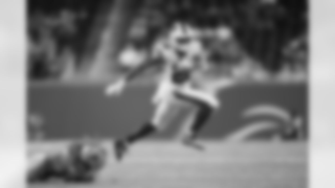 Buffalo Bills running back Matt Breida (22) breaks a tackle attempt by Detroit Lions defensive back Mike Ford (2) during an NFL preseason football game, Friday, Aug. 13, 2021, in Detroit. The Bills defeated the Lions 16-15. (Joe Robbins via AP)