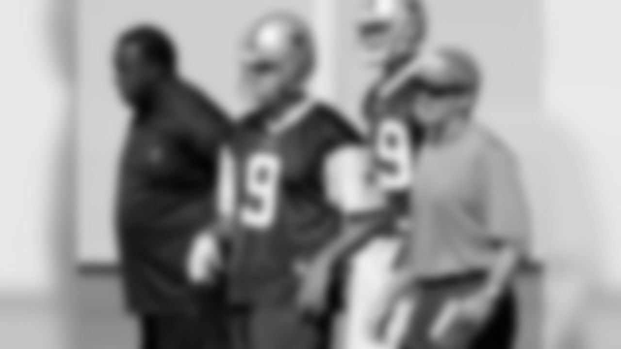 Dallas Cowboys wide receivers coach Ray Sherman, left, quarterback Tony Romo (9) and offensive coordinator Jason Garrett, right, look on during practice at the Cowboys NFL training facility in Irving, Texas, Friday, Oct. 17, 2008. (AP Photo/Tony Gutierrez)