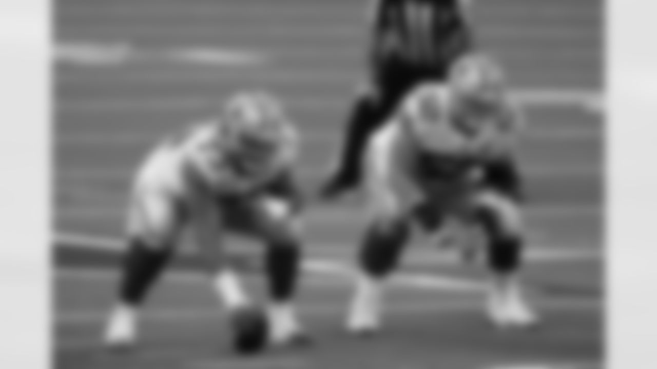 Dallas Cowboys center Joe Looney (73) and guard Connor Williams (52) get set during an NFL game against the Philadelphia Eagles, Sunday, Dec. 27, 2020, in Arlington, Texas. The Cowboys beat the Eagles 37-17. (Cooper Neill via AP)