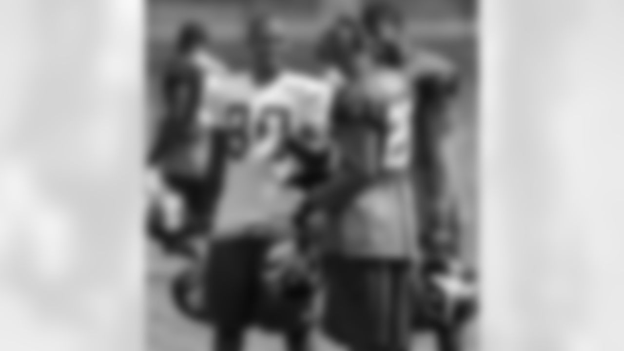 New York Giants wide receiver Victor Cruz (80) talks with safeties Antrel Rolle, center, and Kenny Phillips during a break at NFL football training camp in Albany, N.Y., Sunday, July 29, 2012. Coming off a record-setting season for the Giants.
