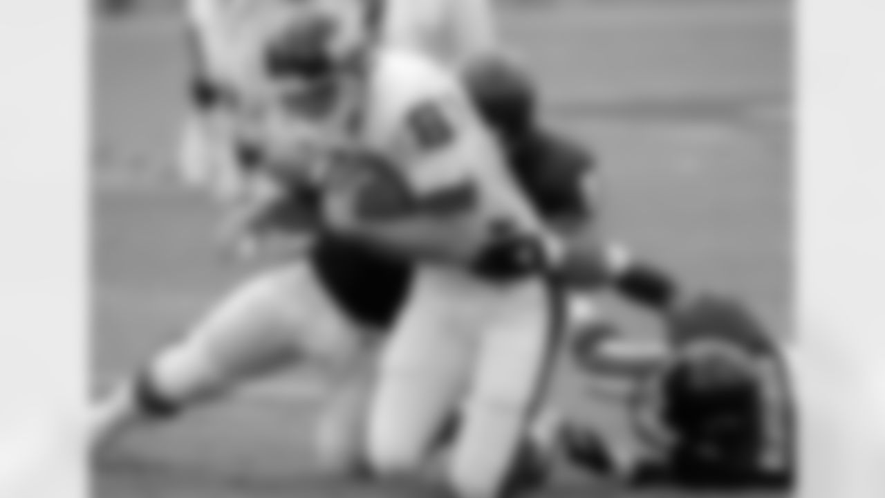 New York Giants wide receiver Ed McCaffrey is tackled after an eight-yard gain by Chicago Bears defenders Chris Zorich, rear, and Anthony Blaylock, right, during the second quarter at Soldier Field in Chicago, Sept. 5, 1993. (AP Photo/Fred Jewell)