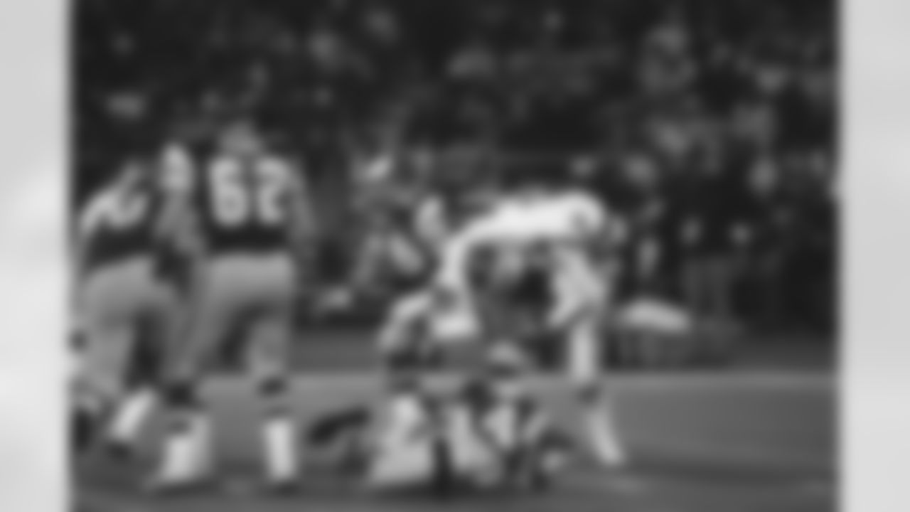 New York Giants Dee Hardison takes a ride on the back of Eagles quarterback Ron Jaworski in wild card playoff game, Dec. 28, 1981, Philadelphia, Pa. Jaworski had a tough day as New Yorks defense limited Jaworski to less than 50 percent of pass completions and sacked him three times. Eagles lost, 27-21. Eagles Hubert Oliver (34), Pete Perot (62) and Jerry Sisemore (76) are also shown. (AP Photo)