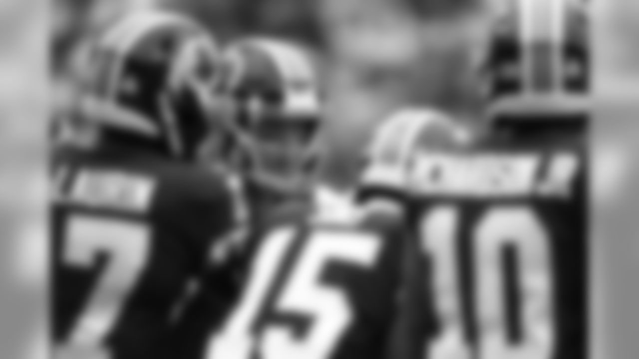 Washington Redskins quarterback Colt McCoy huddles with teammates during the first half of an NFL football game against the New England Patriots, Sunday, Oct. 6, 2019, in Landover, Md. (AP Photo/Patrick Semansky)